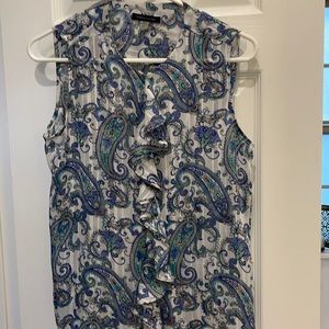 Woman’s top. 100% polyester. Gently worn.